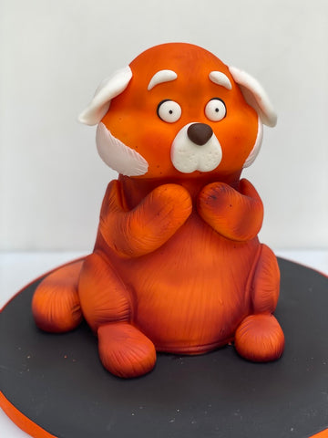 Cake sculpted to look like the red fox from Turning Red