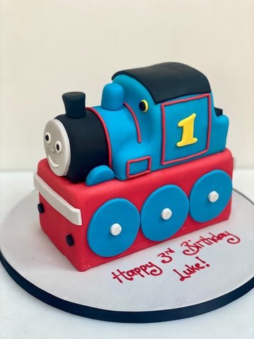 Birthday cake in the shape of thomas the tank engine made in london