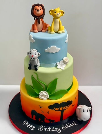 3 Tiered Birthday Cake decorated with Simba and Mustafa from the lion king with a silhouette of the plains