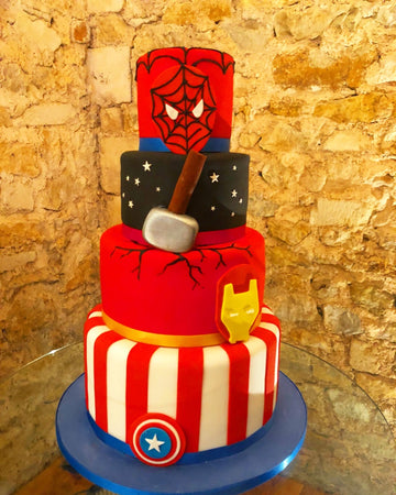 4 tier cake showing spiderman, thor, iron man and captain america
