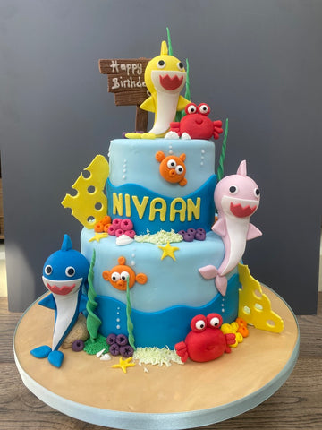 2 tiered Birthday cake decorated with baby sharks