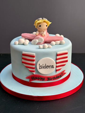 Birthday Cake with Little Girl Flying a Pink Plane on top