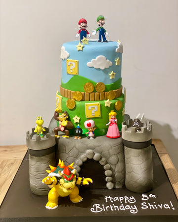 Bowser Castle 3 tier cake with super mario bros themed top tiers
