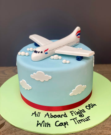 Birthday cake with a sugar british airways plane on top