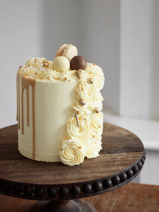 Cascading Rose and Drip Cake With Macarons and chocolates