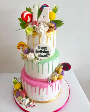 Colourful 3 Tier Drip Birthday cake with macarons lollies and sweets
