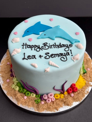children's birthday cake with dolphins for under the sea party