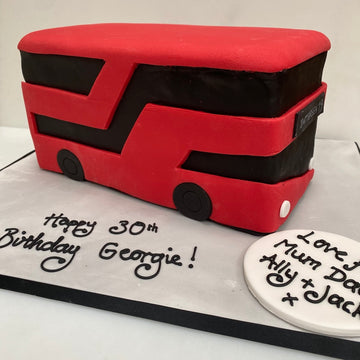 Red double-decker bus-shaped cake