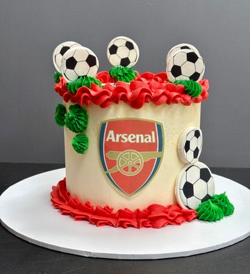 Cake with team logo and football decorations
