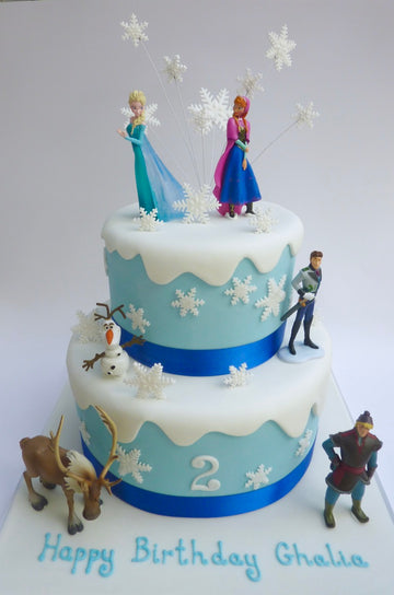 2 tier frozen themed cake with dripping snow