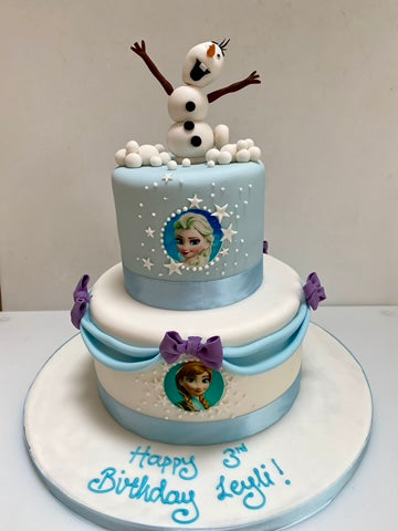 Birthday cake decorated with swags and olaf on top