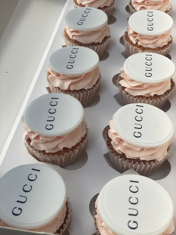 Branded logo cupcakes with Gucci brand on top for corporate event