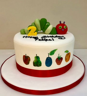 Cake decorated with the hungry caterpillar and fruit