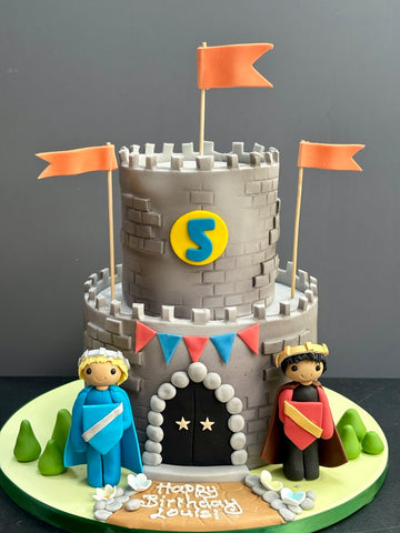 Castle Shaped Birthday cake with two knights in the style of duplex