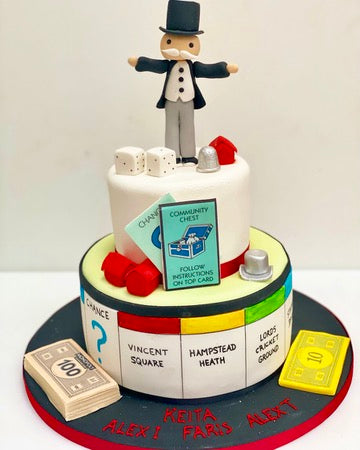 Cake decorated to resemble Monopoly game board with character on top