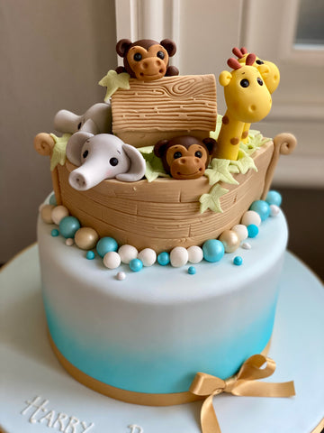 Ombre cake with noah's arc on top with lots of animals