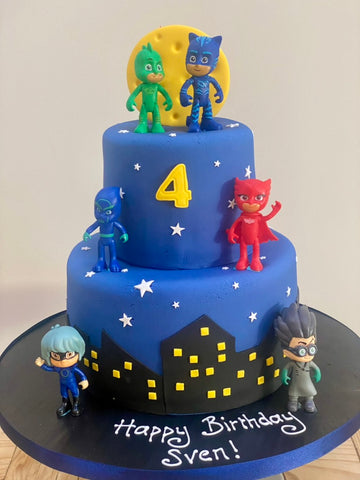 2 tiered birthday cake decorated with PJ Masks figures