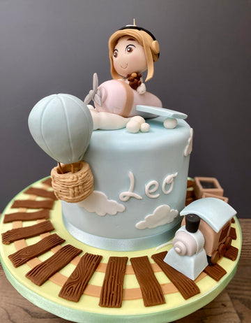 Pale Blue and Beige Plane, Hot Air Balloon and Steam Train Birthday Cake
