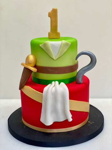 2 tiered birthday cake themed with peter pan and captain hook