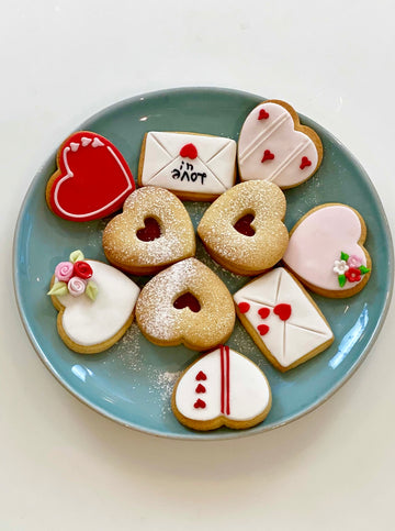 Plate of Valentine Cookies including hearts and love letters