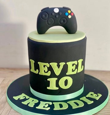 Birthday cake with playstation controller onn top