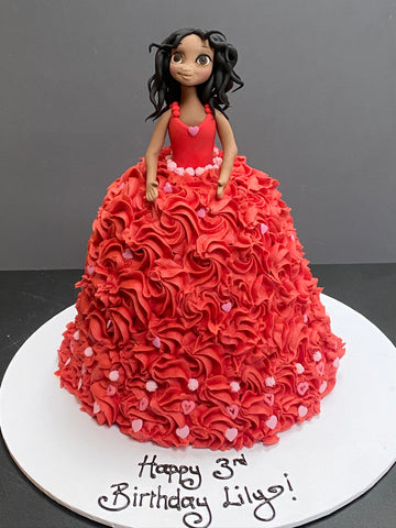 Cake carved to be in the shape of a red princess