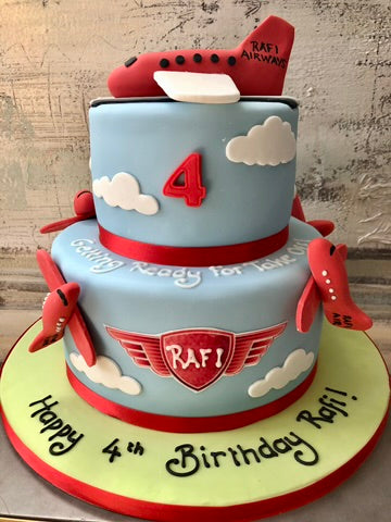 Two-tier birthday cake with airplane theme