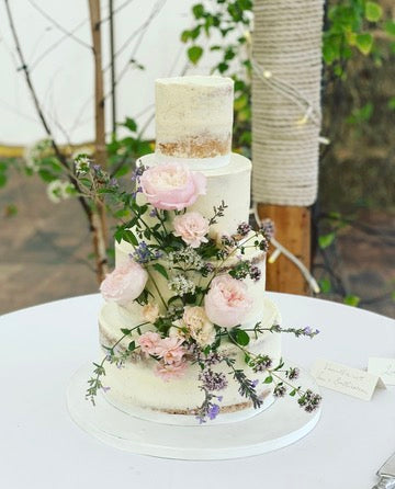 Rustic 4 Tier Wedding Cake with large rustic flower decoration
