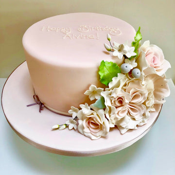 Single Tier pink cake with pink sugar flowers