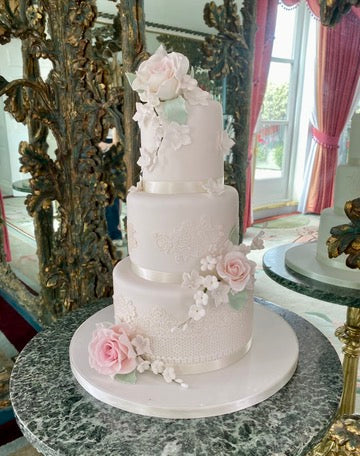 Small 3 Tier Wedding Cake decorated with sugar roses and edible lace