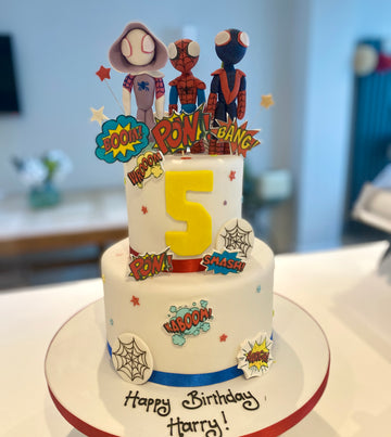 2 tier birthday cake with spidey and friends figures on top