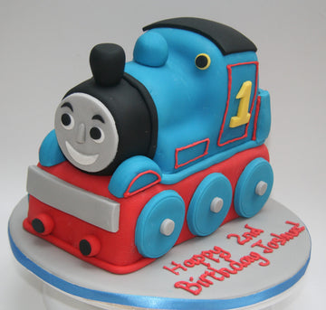 Cake carved to the shape of Thomas the tank engine