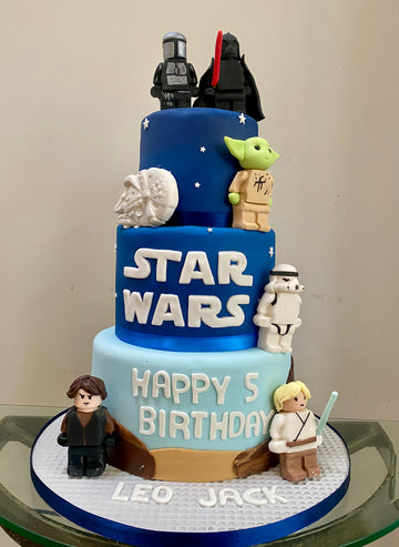 Three-tiered birthday cake decorated with Star Wars characters