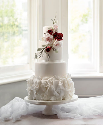White wedding cake with flowers