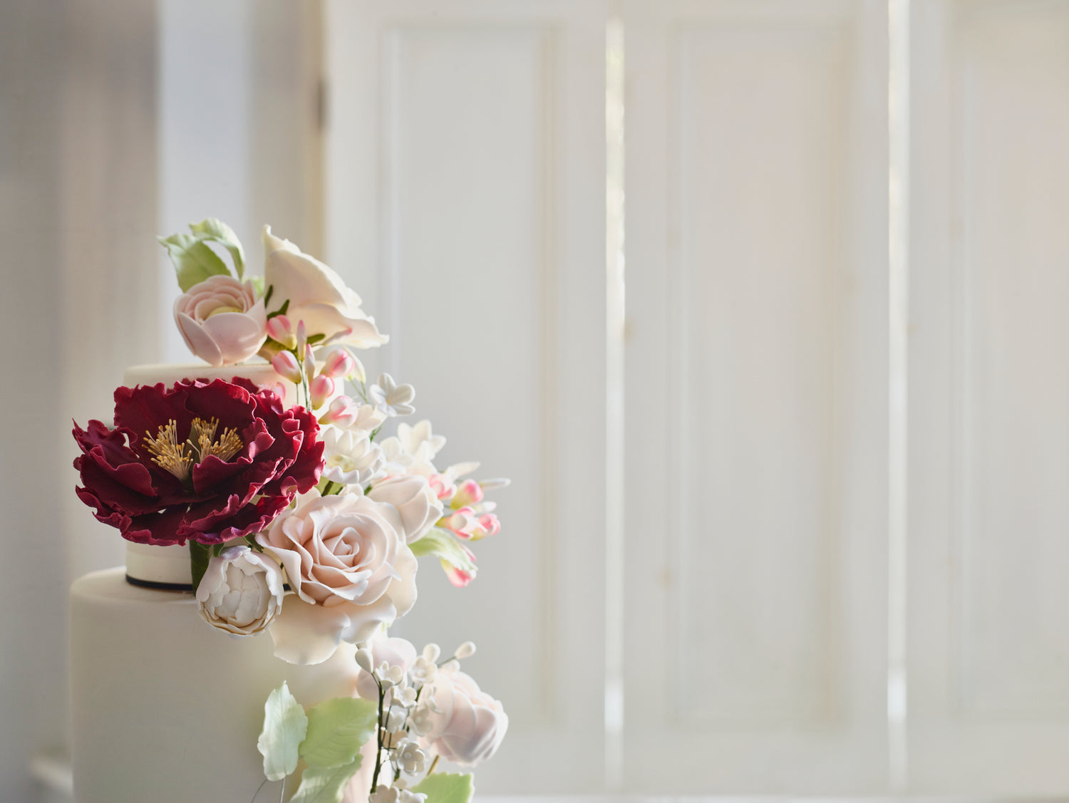 White wedding cake with flowers