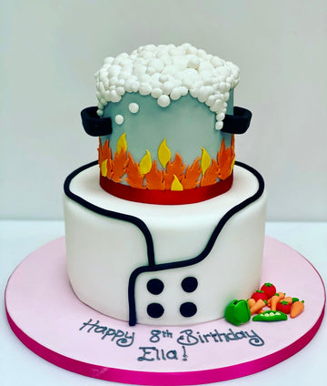 2 tiered cake to look like a chef's jacket and a pot boiling on a stove