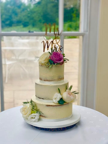 3 Tiered Semi Naked Wedding Cake decorated with Peonies and Roses