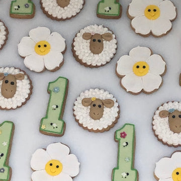 Sheep flowers and number 1 shaped cookies for first birthday