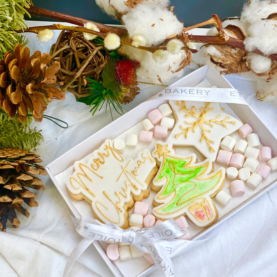 three christmas cookies packaged in a beautiful boxand tied with ribbon available to be posted across uk