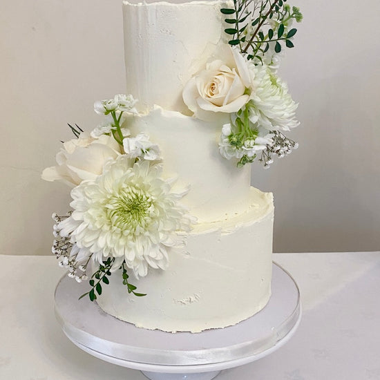 Buttercream Rustic Wedding Cake with fresh flowers delivered in london