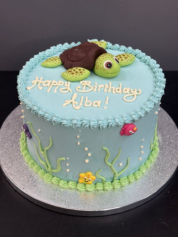Buttercream Turtle Birthday Cake - icing turtle on a buttercream cake decorated to look like the ocean