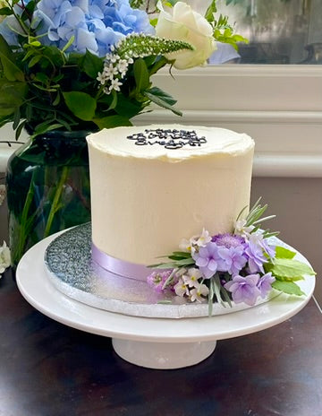 Buttercream cake decorated with fresh flowers ready to order in london