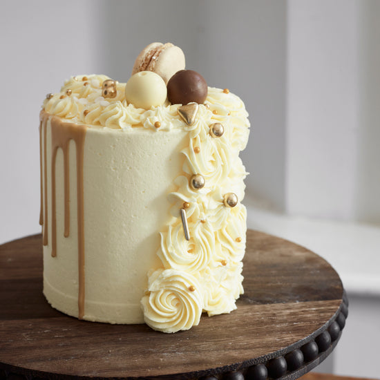 Cascading Rose and Drip Cake With Macarons and chocolates