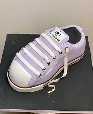 Cake carved to look like a converse trainer