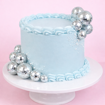 Disco Glitterball Birthday Cake delivered in london with glitterballs decorating a buttercream celebration cake