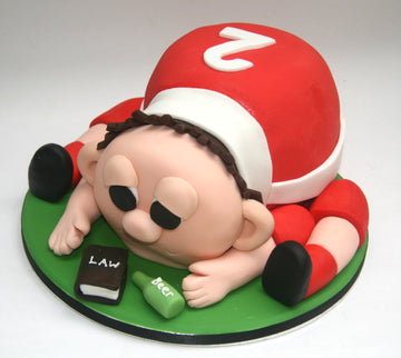 Cake shaped like a drunk rugby player
