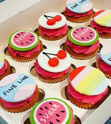 Cupcakes decorated with a harry styles theme