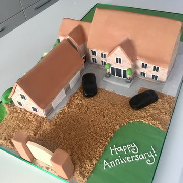 Cake carved to the shape of someone's house