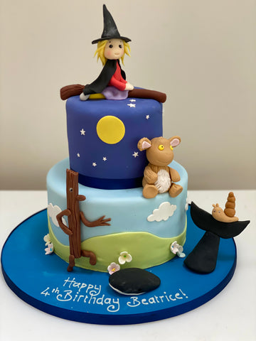 Birthday cake featuring characters from Julia Donaldson's books - witch on a broom, gruffalo, snail and the whale, stickman