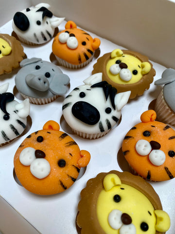 Cupcakes decorated with jungle animal faces